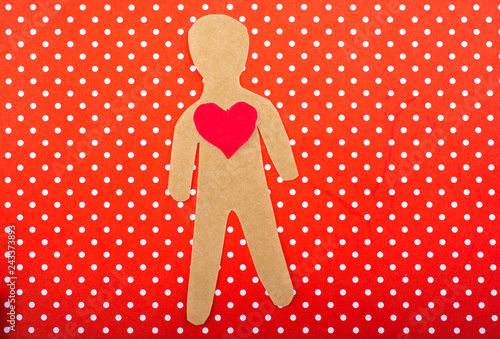 Fotografie, Obraz paper man and a heart shape cut out of paper