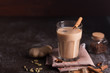Masala chai tea on the dark background. Hot indian beverage with spices. Image with copy space
