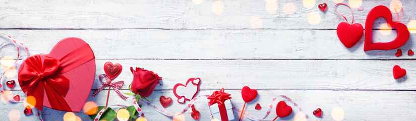 Wall Mural - valentines day decoration with gift on white wooden plank