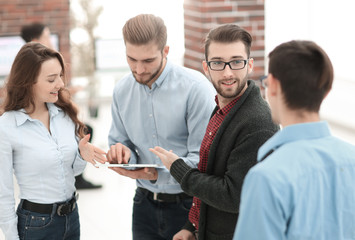 Poster - Business team with tablet pc computer having discussion in offic