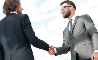 Sticker - Young businessman shaking hands after agree to collaborate.