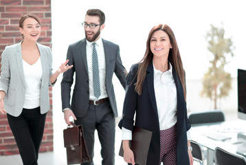 Poster - business woman and employees in the workplace.