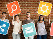 © Rawpixel.com - Diverse happy people with social networking icons
