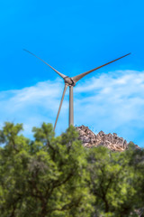 Wall Mural - View of a wind turbine on top of mountains