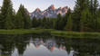 sunrise shot of grand teton mountain reflected in a pond at schwabacher's landing in grand teton national park in the united states