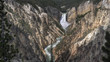 wide shot of high water flow over yellowstone falls from artist point in yellowstone national park in the united states