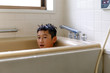 © Takuma Imamura - A boy taking a bath.