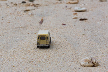 Toy 4x4 Offroad Vehicle Drives At The Beach