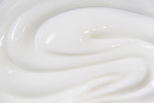 The White Surface Of The Cream Lotion Softens The Background.