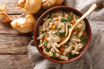 Polish stew flaki with vegetables close-up in a bowl. Horizontal top view