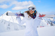 © ZoomTeam - Portrait of beautiful woman with ski and ski suit in winter mountain.