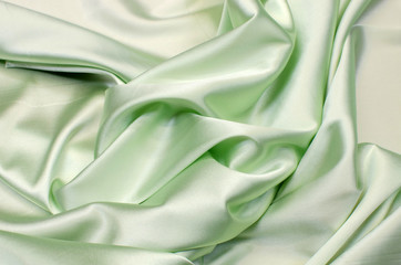 Wall Mural - Satin silk fabric in light green color