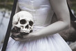 © darkbird - Human skull in creepy bride hands. Halloween concept