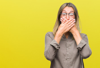 Poster - Young beautiful woman over isolated background shocked covering mouth with hands for mistake. Secret concept.