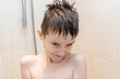 © ReaLiia - Hygienic procedures and healthy habits of a preteen boy - taking shower and washing hair with shampoo