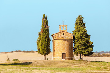 Scenic landscape with old chapel in Tuscany, Italy at autumn