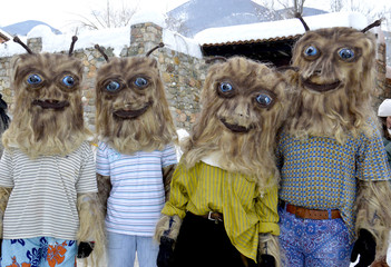 dressed up participants at an annual Vevcani Carnival, in southwestern Macedonia