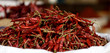 Basket of fresh dried raw red chili peppers in the Khari Baoli spice market of Old Delhi, India.