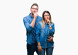 © Krakenimages.com - Young couple in love wearing glasses over isolated background with hand on chin thinking about question, pensive expression. Smiling with thoughtful face. Doubt concept.