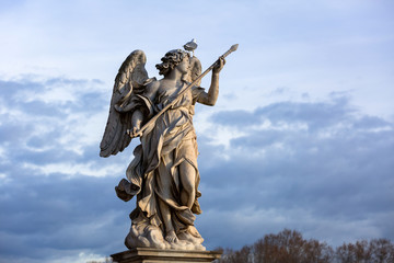 Angel statue on the Saint Angelo Bridge over Tiber river in Rome, Italy