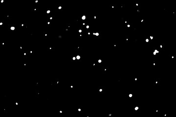 snow on black background. falling snow texture.