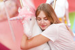 © primipil - Young female and white unicorn on pink background