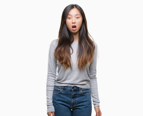 Wall Mural - Young asian woman over isolated background afraid and shocked with surprise expression, fear and excited face.