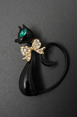 Wall Mural - brooch cat with gems isolated on black