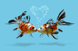 A couple of fishes with heart shaped air bubbles, kissing lovers, Love, romance, Saint Valentines day, Collage of gold fish isolated on blue background