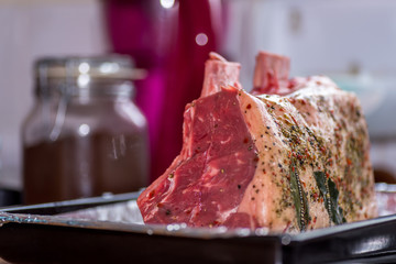 Sticker - closeup view raw beef cross rib chunk on oven tray with foil