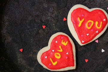 Two heart shaped conversation  cookies with writing love you