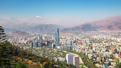 Wall Mural - Aaerial view of Santiago skyline at sunset with Andes Mountains - Santiago, Chile