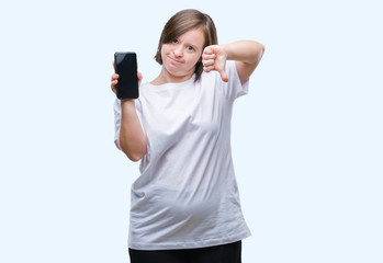 Sticker - Young adult woman with down syndrome showing smartphone screen over isolated background with angry face, negative sign showing dislike with thumbs down, rejection concept