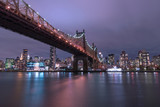 Fototapeta  - View on Queensboro bridge and Midtown Manhattan  from east river at night with long exposure