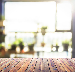 Wall Mural - City concept: Wood table top on blur glass window wall building background