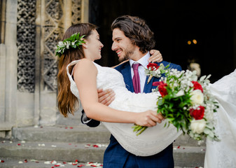 Groom lifting up his beautiful bride