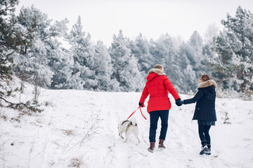 Beautiful couple playing with a dog