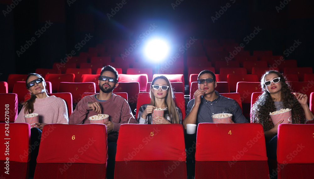 Friends watching movie in cinema