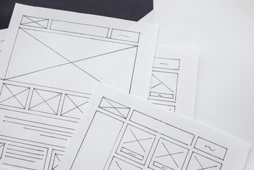 Wall Mural - ux website designer drawing wireframe sketch of prototype, framework, layout future project. creativ