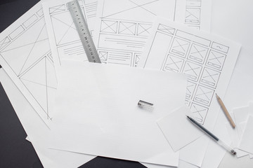 Wall Mural - ux website designer drawing wireframe sketch of prototype, framework, layout future project. creativ
