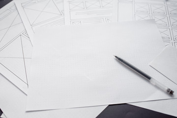 Wall Mural - ux website designer drawing wireframe sketch of prototype, framework, layout future project. creativ