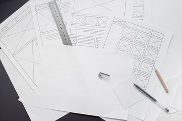 Wall Mural - ux website designer drawing wireframe sketch of prototype, framework, layout future project. creativ