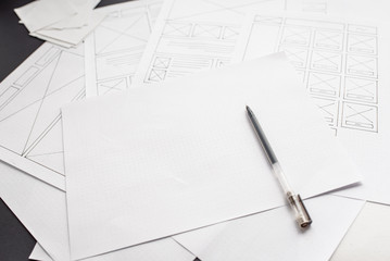 Wall Mural - ux website designer drawing wireframe sketch of prototype, framework, layout future project. creativ