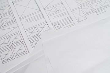 Wall Mural - ux website designer drawing wireframe sketch of prototype, framework, layout future project. creativ
