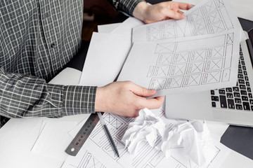 Wall Mural - ux website designer drawing wireframe sketch of prototype, framework, layout future project. creativ