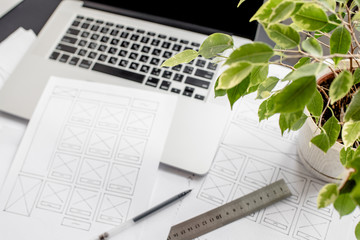 Wall Mural - ux website designer drawing wireframe sketch of prototype, framework, layout future project. creativ