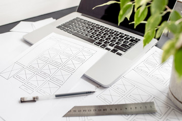 Wall Mural - ux website designer drawing wireframe sketch of prototype, framework, layout future project. creativ