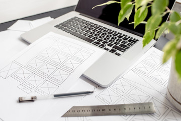 Wall Mural - ux website designer drawing wireframe sketch of prototype, framework, layout future project. creativ