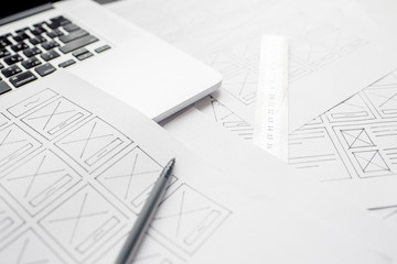 Wall Mural - ux website designer drawing wireframe sketch of prototype, framework, layout future project. creativ