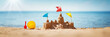 canvas print picture - Sandcastle on the sea in summertime